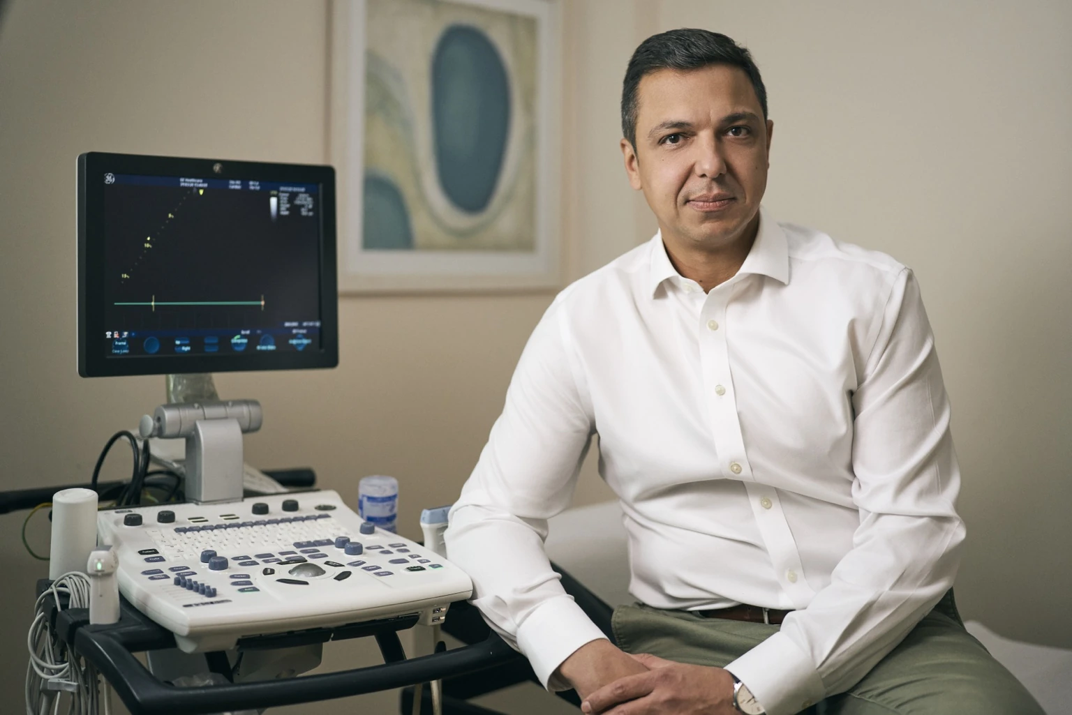 Georgios Petridis beside the clinic's ultrasound scanner